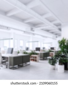 Modern Business Office Without People With Blurred Bokeh Background. Tables, Chairs, Computers. Copy Space. High Quality Photo