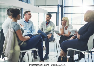 Modern business people in an informal team building discussion or business talking session. Team leader, manager or supervisor talking to a group of employees or colleagues on new workflow - Shutterstock ID 2188062171