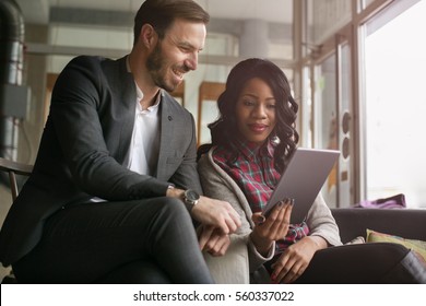 Modern Business People Working At A Cafe.