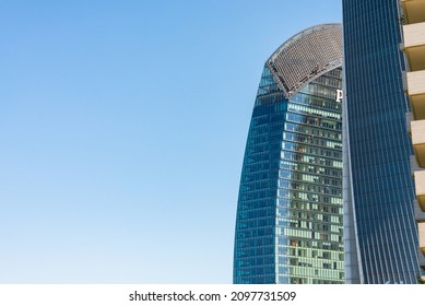 Modern business skyscrapers in the financial district of Citylife, Milan, Italy. Blue sky on the background, with copy-space.