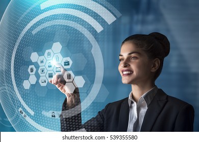 Modern Business Woman Using Innovative Technologies To Manage Her Administrative Work, Using A Digital Hologram Erp System