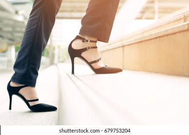 Modern Businesswoman Working Woman Close-up Legs Walking Up The Stairs In Modern City. In Rush Hour To Work In Office A Hurry. During The First Morning Of Work.