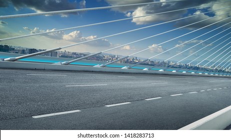 Modern Cable-stayed Bridge Speedway With Cityscape .Side Angle View . Morning Scene .