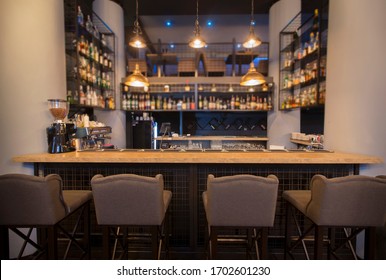 Modern Cafe Interior With Wooden Counter And Chairs, No People, Online Bar, Copy Space