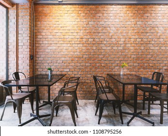 Modern Cafe In Loft Style, Black Table Set For Coffee With Brick Wall