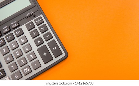 Modern Calculator, Business And Finance Accounting Concept On Orange Background With Space For Text.