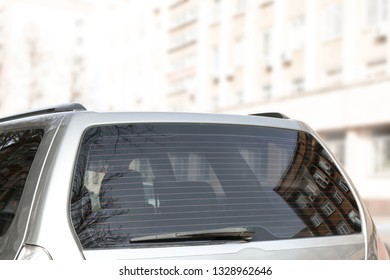 Modern car with clean rear window outdoors