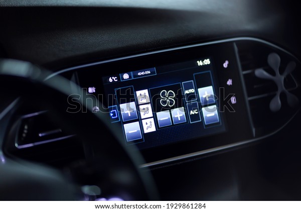Modern car climate control panel display for\
driver and passenger with shallow depth of field. Zone climate\
control. Car interior\
detail.