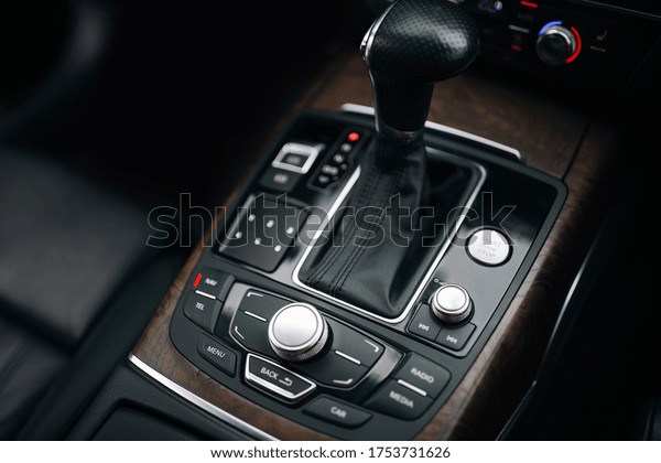 Modern car control\
panel with gearbox\
handle