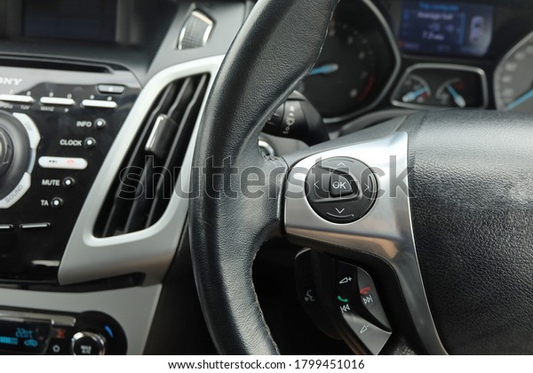 Modern car dashboard. The past of\
dashboard on steering wheel. Closeup interior modern car. Audio\
control button on the steering wheel inside the\
car.