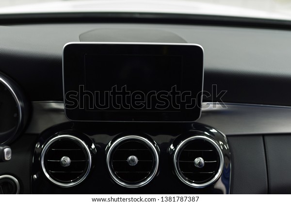 Modern car dashboard with screen multimedia\
system. Interior detail.