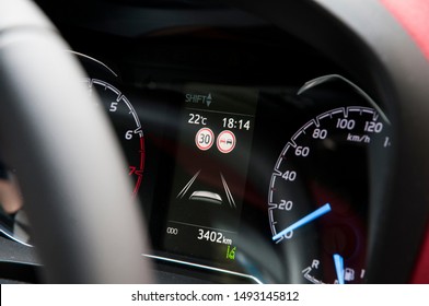 Modern Car Dashboard With Speed Limit And Overtaking Signs