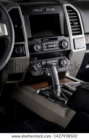 Modern car dashboard, touch screen, technological system designed for the driver