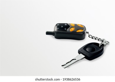 Modern Car Flip Key With Trinket On The Desk