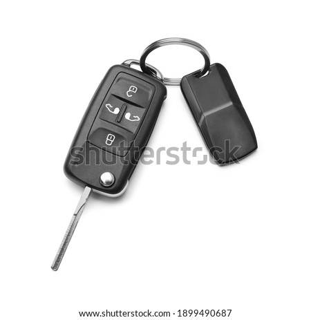 Modern car flip key with trinket isolated on white, top view