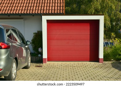 Modern Car Garage with automatic Door in Front of a residential Building