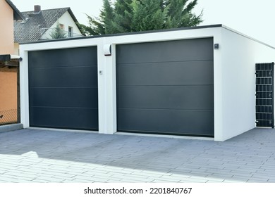 Modern Car Garage built of Concrete in Front of a residential Building - Shutterstock ID 2201840767