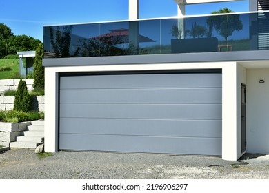 Modern Car Garage with remote-controlled automatic Door in Front of a residential Building