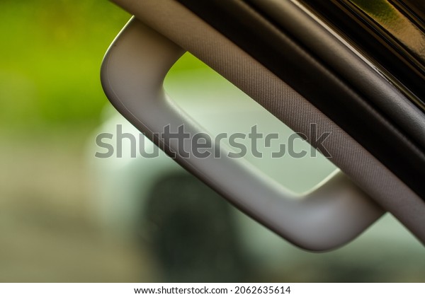 Modern Car Grab Handles,\
car interior details. Car grab handler for the passenger. Car\
ceiling handle.