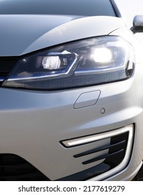 Modern Car Headlamp Flashing Light With Blinking On Continuously Indicator. Car Front Full Led Light. Switched On Led Lights Of Luxury Car. Car Blinker Light.