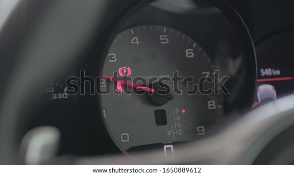 Modern\
car illuminated dashboard closeup.The sign and symbol on car\
dashboard. Car speedometer closeup. Car\
interior.
