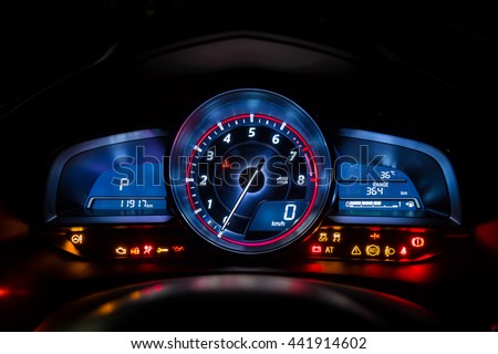 Modern car instrument dashboard panel or speedometer and full symbol in night time