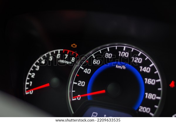Modern car interior.\
Car dashboard. Engine system. Automobile speedometer. Modern\
transportation. Auto panel and steering wheel. Speed measure.\
Illuminated car\
dashboard.