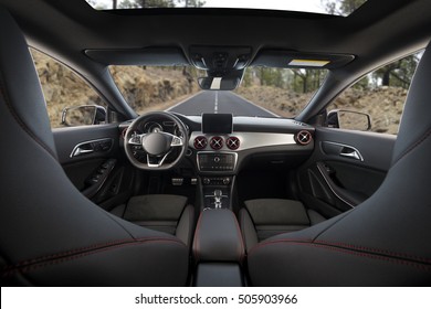 Modern Car Interior Dashboard, Forest Road In The Windshield