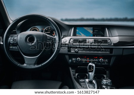 Modern car interior, with dashboard and navigation monitor