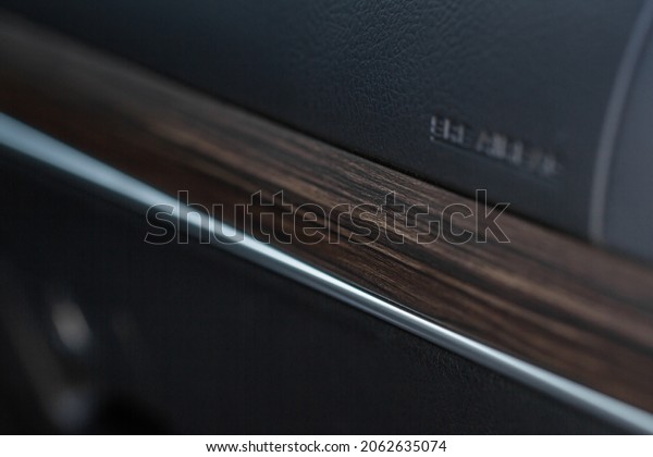 Modern car interior details. Car wooden panel.\
Interior of prestige modern\
car.