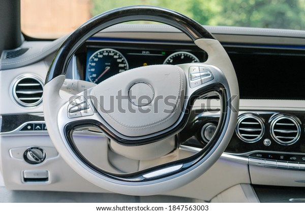 Modern\
car interior in light colors and navigation\
device