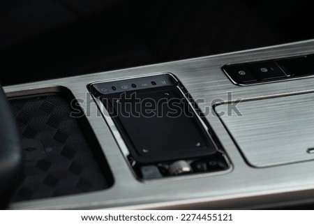 Modern car interior. Media control touchpad. Car touchpad close up.