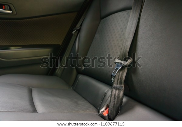Modern car interior -\
rear seats with the seat belts (shallow DOF - selective focus;\
color toned image)