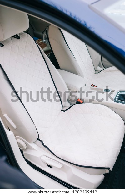 Modern\
car interior, white perforated leather, aluminum, details controls,\
leather steering wheel, LED in interior\
lighting.
