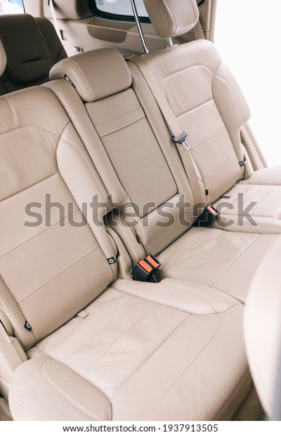 Modern car interior, white perforated leather,\
aluminum, controls.