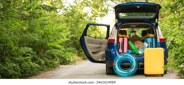 Modern car with luggage outdoors - Powered by Shutterstock