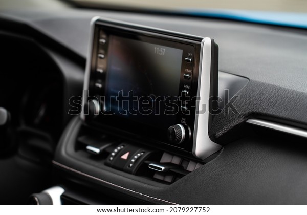 Modern car media\
display in the interior of the car. Touchscreen monitor on the\
dashboard of the modern\
car.