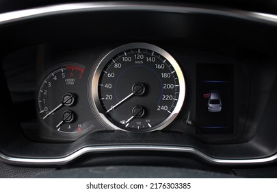 Modern Car Odometer With Illuminated Control Lamps. Modern Car Speedometer. Modern Car Dashboard.