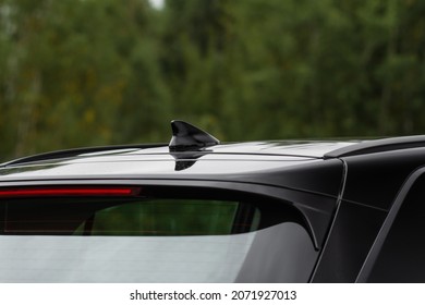 Modern car radio antenna. Shark fin antenna. Modern car roof. - Shutterstock ID 2071927013