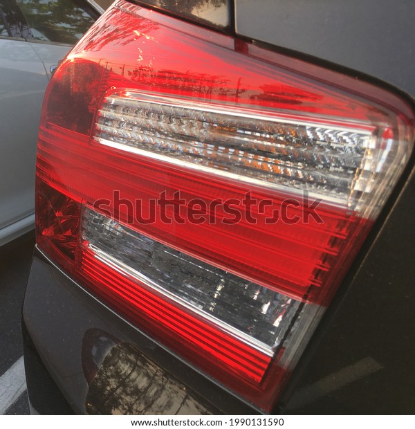 Modern car tail light. Black modern car back light.\
closeup shot.
