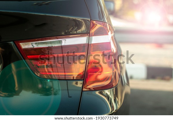 Modern car tail light.Black modern car back\
light.closeup shot.\
