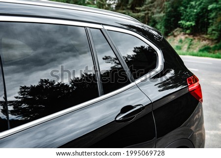 Modern car with tint back windows.