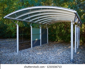 Modern carport car garage parking made of silver metal and glass                                       