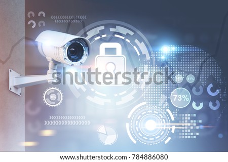 Modern CCTV camera on a wall. A blurred background with an abstract infographics and security HUD. Toned image double exposure mock up