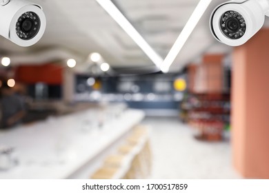 Modern CCTV Security Camera In Modern Store. Guard Equipment