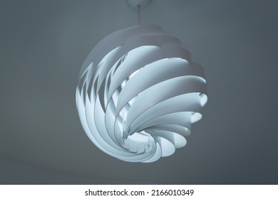 Modern ceiling lamps and light bulbs ball shape decoration for home and living from the plastic sheet sphere spiral shape geometry pattern. Concept interior building contemporary.