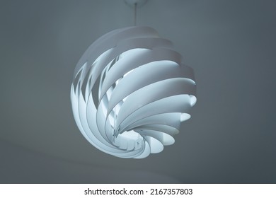 Modern ceiling lamps and light bulbs ball shape decoration for home and living from the plastic sheet sphere spiral shape geometry pattern. Concept interior building contemporary.