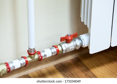 Modern central heating lamellar radiator connected to the system