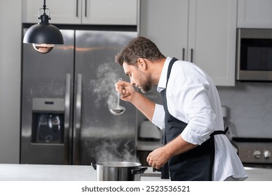 modern chef in professional uniform. close-up on the hand of male chef who is stirring soup in pot with spoon. cooking, culinary and people concept - male chef in toque with pot or saucepan. - Powered by Shutterstock