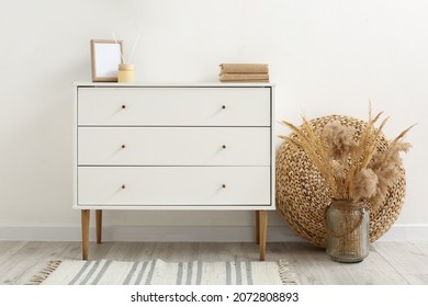 Modern Chest Of Drawers With Frame Near Light Wall